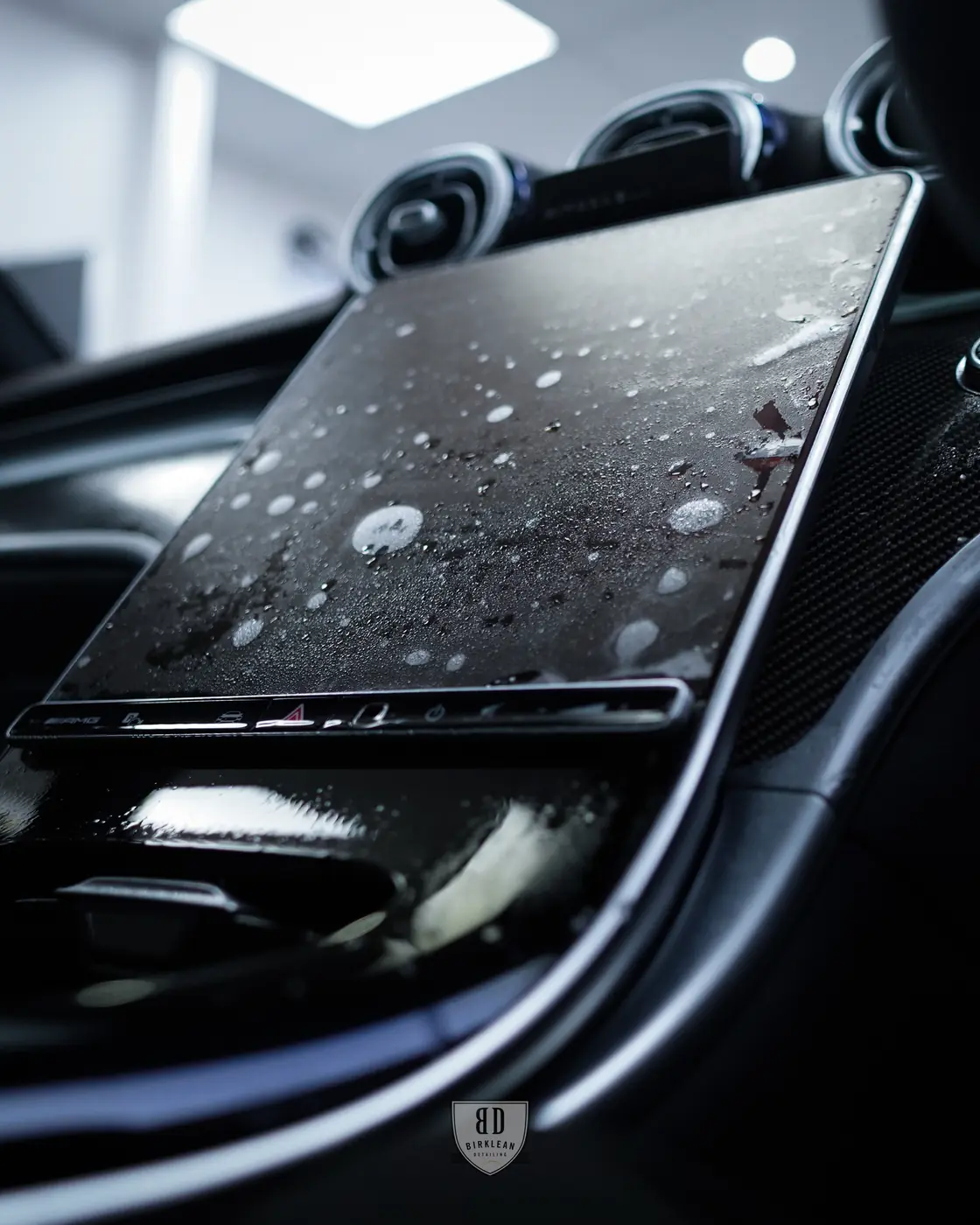 Interior PPF protecting trim and display surfaces in a used car